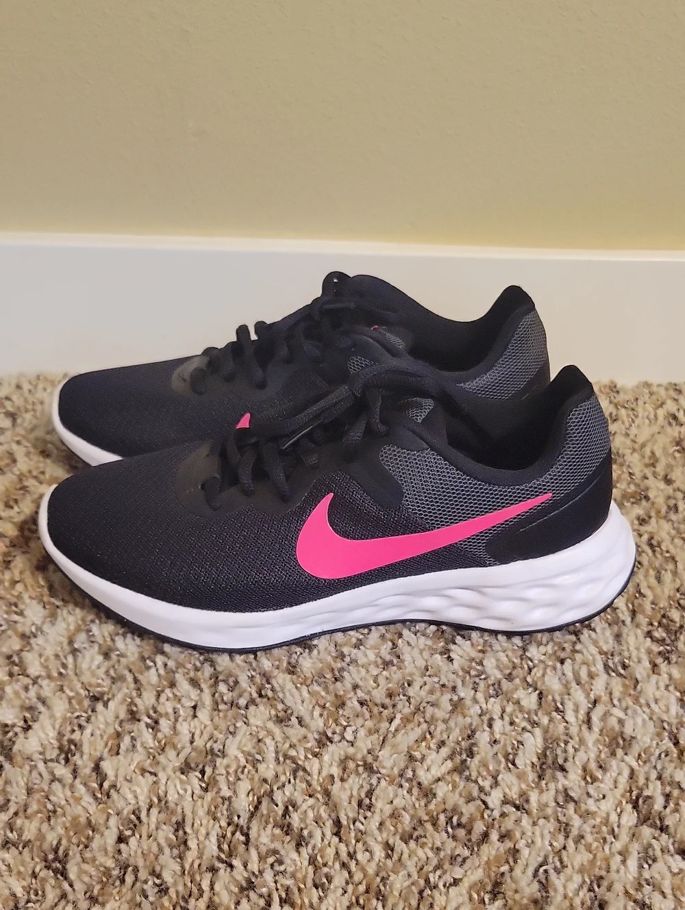 Nike Women's Black Running Shoes with Pink Swoosh